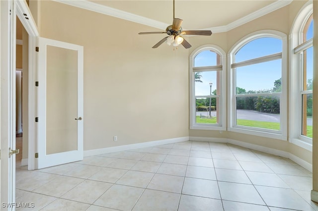 6140 River Shore Ct, North Fort Myers, FL 33917 - spare room with ornamental molding, a ceiling fan, french doors, baseboards, and light tile patterned flooring
