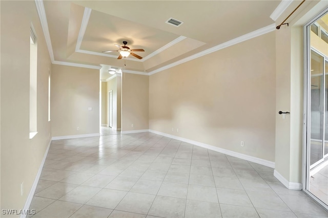 6140 River Shore Ct, North Fort Myers, FL 33917 - empty room with a tray ceiling, ceiling fan, light tile patterned floors, ornamental molding, and baseboards