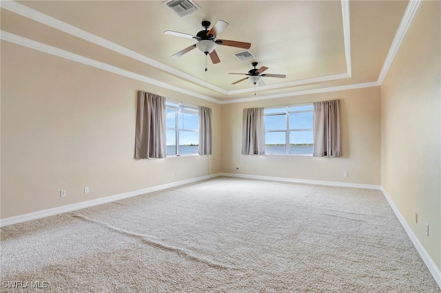 6140 River Shore Ct, North Fort Myers, FL 33917 - carpeted empty room with a raised ceiling, a ceiling fan, crown molding, and baseboards