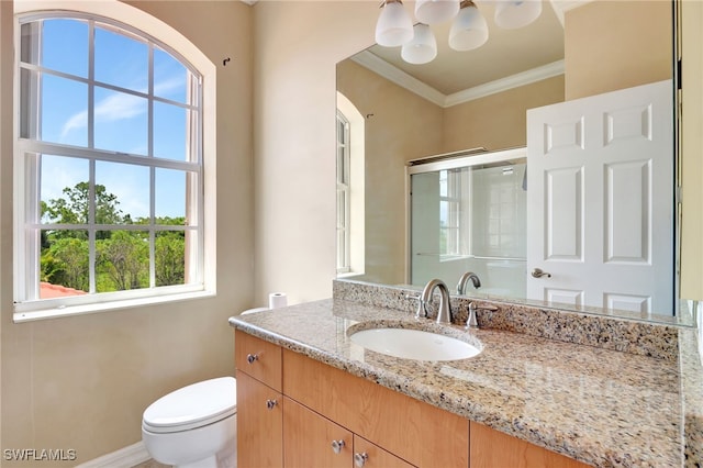 6140 River Shore Ct, North Fort Myers, FL 33917 - bathroom with vanity, toilet, crown molding, and a shower with door