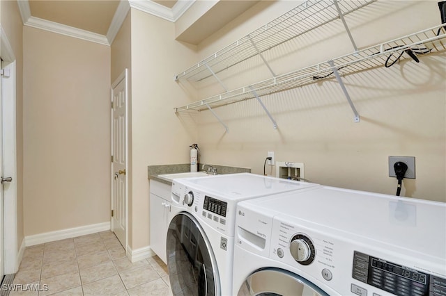 6140 River Shore Ct, North Fort Myers, FL 33917 - washroom with independent washer and dryer, ornamental molding, cabinet space, baseboards, and light tile patterned flooring