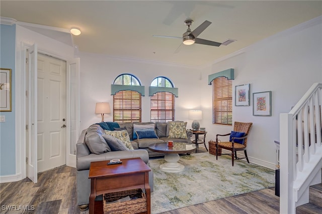 8163 Bibiana Way Unit 301, Fort Myers, FL 33912 - living area featuring a ceiling fan, dark wood-style floors, ornamental molding, stairway, and baseboards