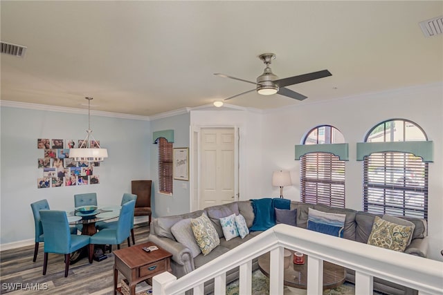 8163 Bibiana Way Unit 301, Fort Myers, FL 33912 - living room featuring ceiling fan, wood finished floors, ornamental molding, and baseboards