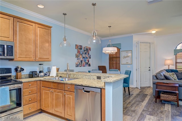 8163 Bibiana Way Unit 301, Fort Myers, FL 33912 - kitchen featuring stainless steel appliances, a sink, a peninsula, light stone countertops, and light wood-type flooring