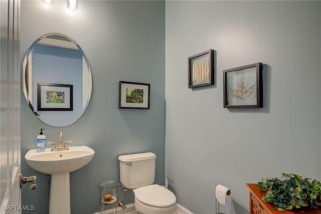 8163 Bibiana Way Unit 301, Fort Myers, FL 33912 - half bath featuring toilet, baseboards, and a sink
