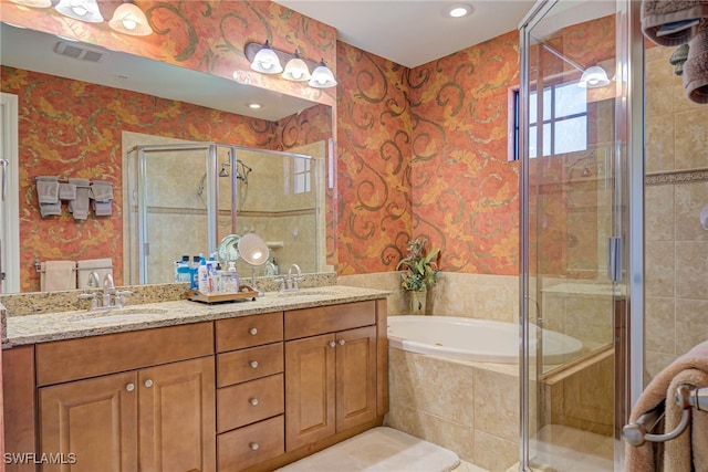 8163 Bibiana Way Unit 301, Fort Myers, FL 33912 - bathroom with wallpapered walls, a stall shower, a garden tub, double vanity, and recessed lighting