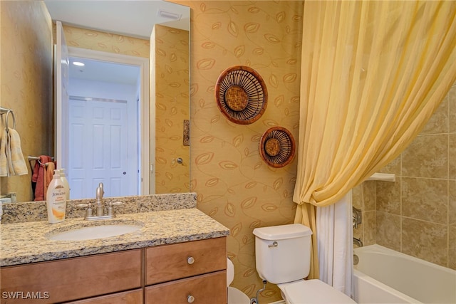 8163 Bibiana Way Unit 301, Fort Myers, FL 33912 - bathroom featuring wallpapered walls, toilet, vanity, and shower / bath combo with shower curtain