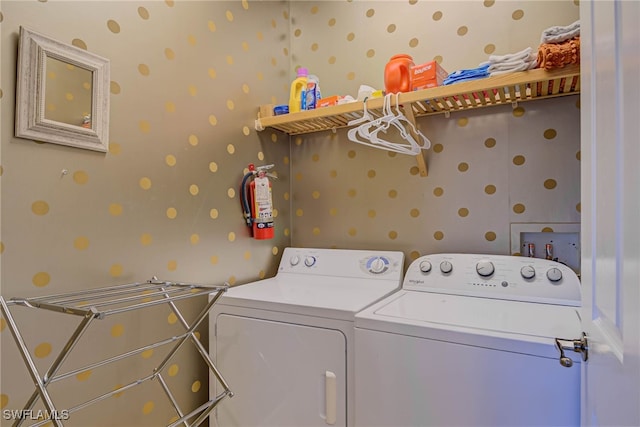 8163 Bibiana Way Unit 301, Fort Myers, FL 33912 - laundry room with wallpapered walls and washing machine and dryer