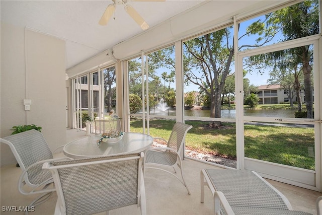 600 Diamond Cir Unit 607, Naples, FL 34110 - sunroom featuring a water view, ceiling fan, and outdoor dining space