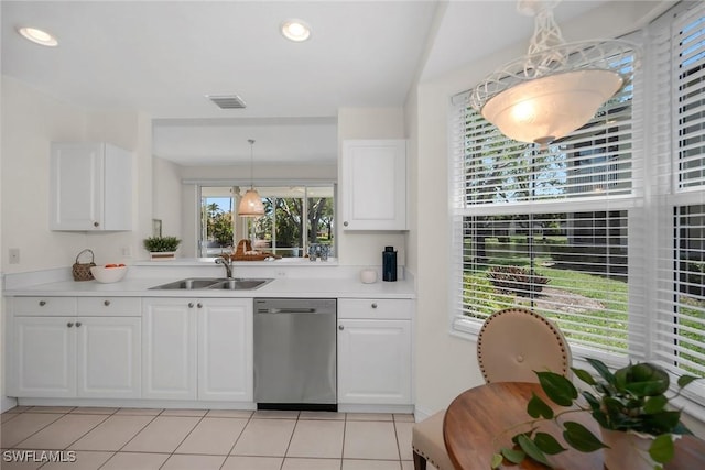 600 Diamond Cir Unit 607, Naples, FL 34110 - kitchen with stainless steel dishwasher, a sink, light countertops, healthy amount of natural light, and recessed lighting