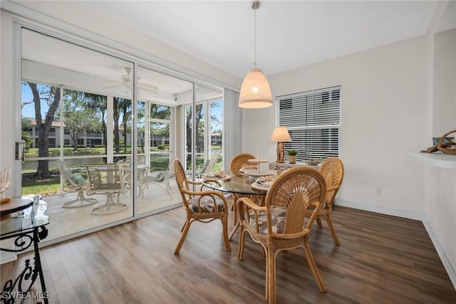 600 Diamond Cir Unit 607, Naples, FL 34110 - dining area with plenty of natural light, wood finished floors, a ceiling fan, and baseboards