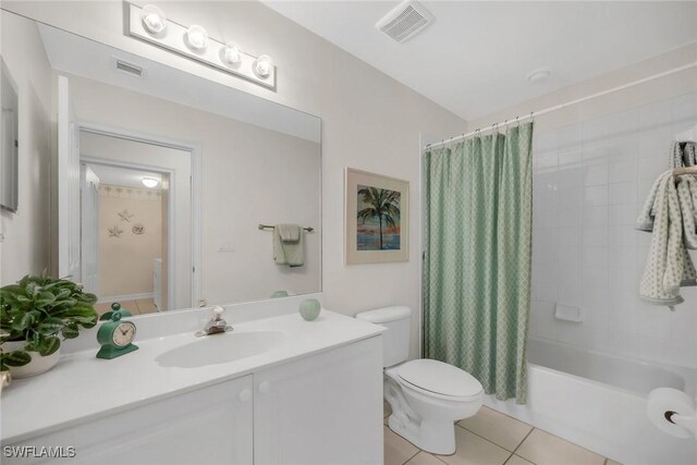 600 Diamond Cir Unit 607, Naples, FL 34110 - bathroom featuring toilet, tile patterned flooring, shower / bath combo, and vanity