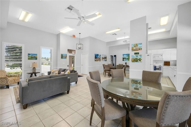 600 Diamond Cir Unit 607, Naples, FL 34110 - dining space featuring ceiling fan, light tile patterned flooring, and a towering ceiling
