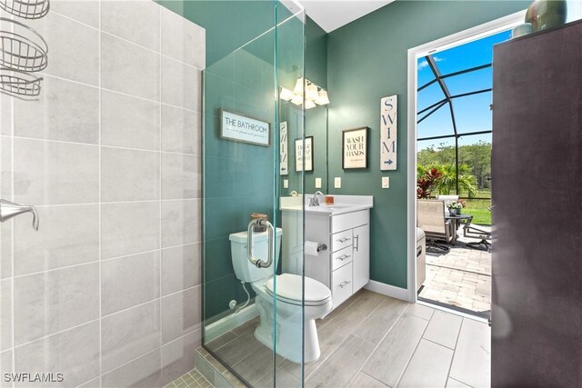 20467 Napa Loop, Estero, FL 33928 - bathroom featuring vanity, toilet, a shower, and baseboards