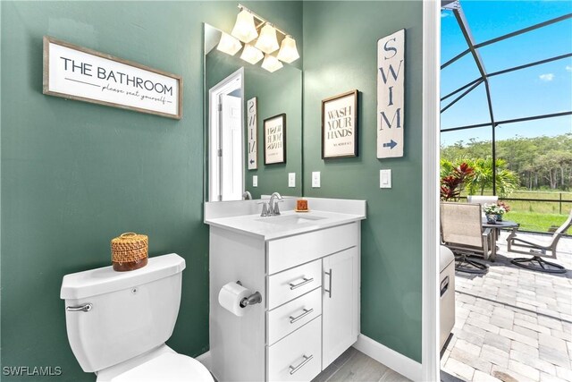 20467 Napa Loop, Estero, FL 33928 - half bath featuring vanity, toilet, and baseboards