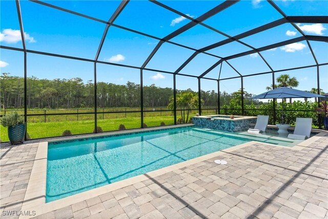 20467 Napa Loop, Estero, FL 33928 - view of pool featuring a patio, a pool with connected hot tub, glass enclosure, and a lawn