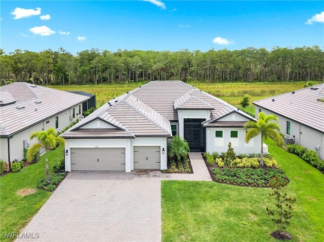 20467 Napa Loop, Estero, FL 33928 - single story home with an attached garage, driveway, a front yard, and a tile roof
