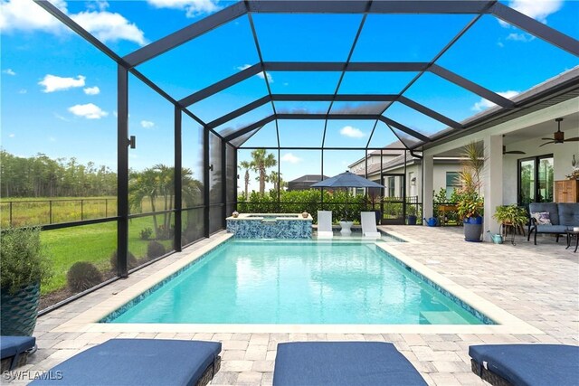 20467 Napa Loop, Estero, FL 33928 - view of pool featuring a patio, a ceiling fan, a pool with connected hot tub, and glass enclosure