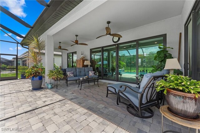 20467 Napa Loop, Estero, FL 33928 - view of patio with an outdoor living space, glass enclosure, an outdoor pool, and a ceiling fan