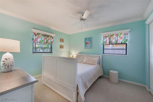 3586 Santiago Way, Naples, FL 34105 - bedroom featuring light carpet, ornamental molding, baseboards, a textured ceiling, and ceiling fan