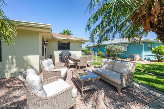 3586 Santiago Way, Naples, FL 34105 - view of patio with an outdoor hangout area, fence, a grill, and outdoor dining space