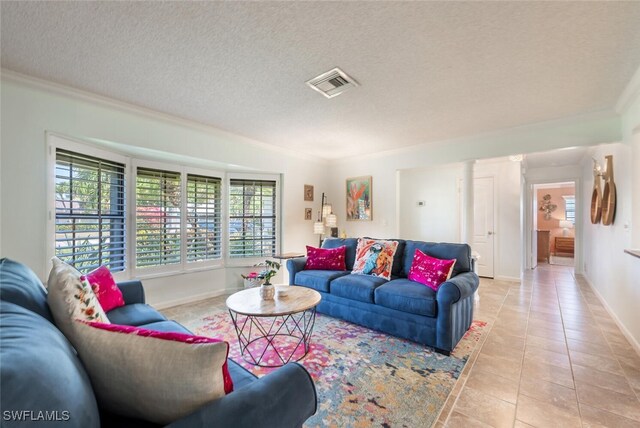 3586 Santiago Way, Naples, FL 34105 - living room with crown molding, light tile patterned floors, baseboards, and a textured ceiling