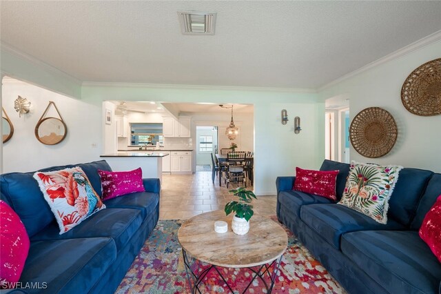 3586 Santiago Way, Naples, FL 34105 - living area featuring crown molding and a textured ceiling