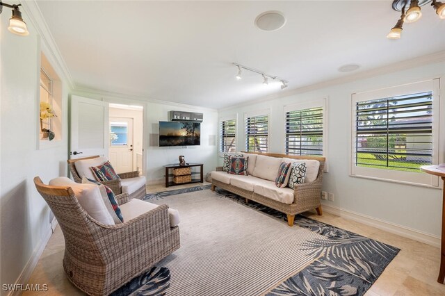 3586 Santiago Way, Naples, FL 34105 - living area featuring ornamental molding, baseboards, and rail lighting