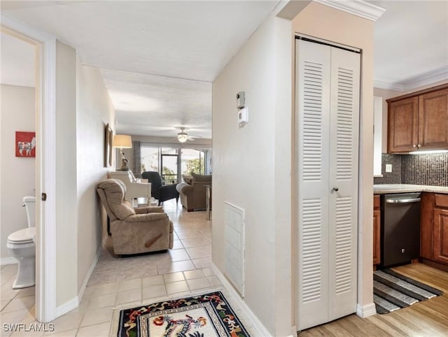 11921 Seabreeze Cove Ln Unit 104, Fort Myers, FL 33908 - hall with light tile patterned floors and baseboards