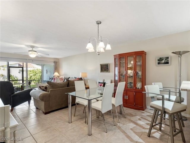 11921 Seabreeze Cove Ln Unit 104, Fort Myers, FL 33908 - dining room featuring a chandelier, ceiling fan, and light tile patterned flooring