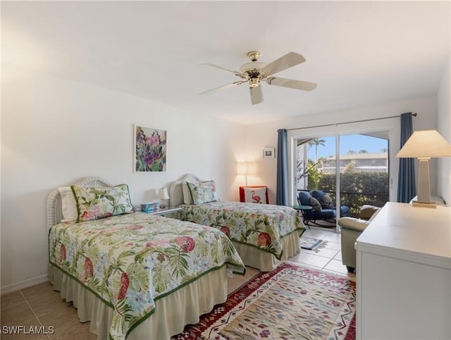 11921 Seabreeze Cove Ln Unit 104, Fort Myers, FL 33908 - bedroom with light tile patterned floors, access to outside, ceiling fan, and baseboards