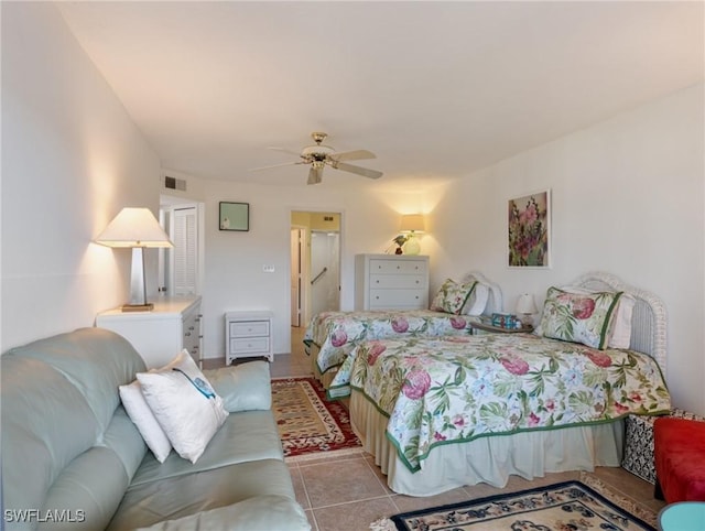 11921 Seabreeze Cove Ln Unit 104, Fort Myers, FL 33908 - bedroom with light tile patterned floors and ceiling fan
