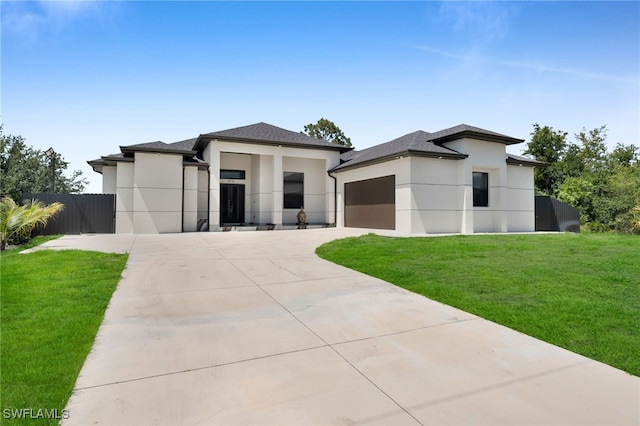 3316 13th St W, Lehigh Acres, FL 33971 - view of front of home with stucco siding, driveway, an attached garage, and a shingled roof