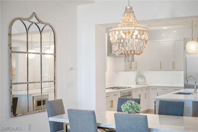 875 6th Ave S Unit 304, Naples, FL 34102 - dining space featuring a chandelier
