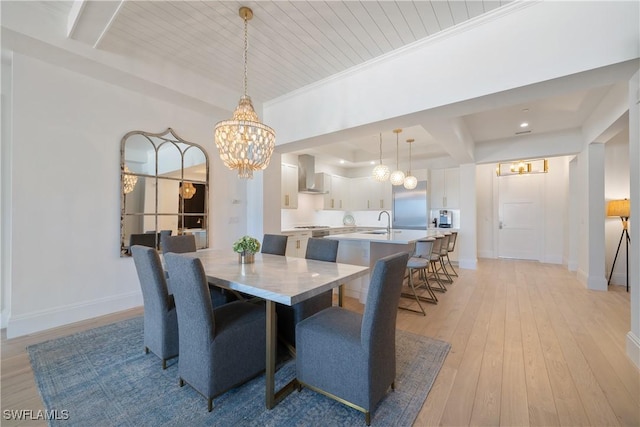 875 6th Ave S Unit 304, Naples, FL 34102 - dining room with a chandelier, light wood-style flooring, baseboards, and beamed ceiling