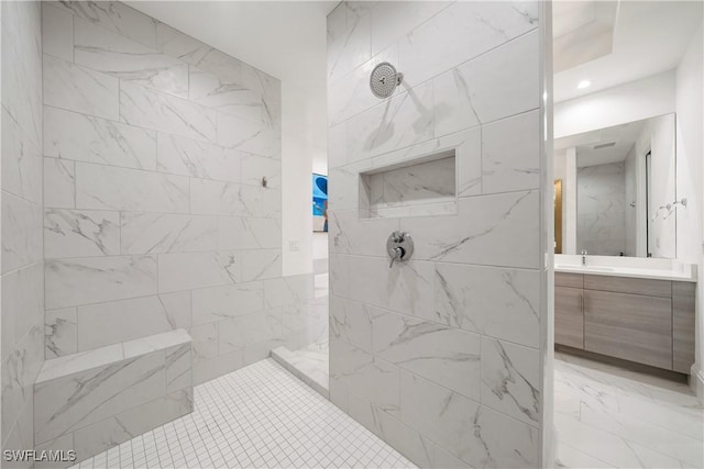 875 6th Ave S Unit 304, Naples, FL 34102 - bathroom with tiled shower, vanity, recessed lighting, and marble finish flooring
