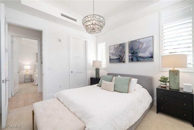 875 6th Ave S Unit 304, Naples, FL 34102 - bedroom with a chandelier and a closet