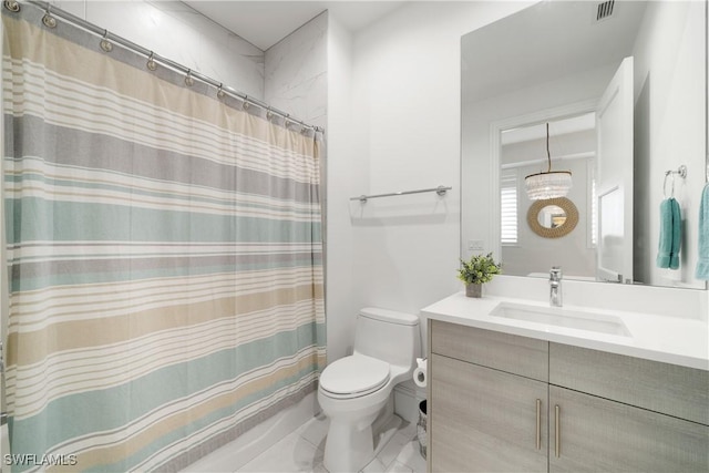 875 6th Ave S Unit 304, Naples, FL 34102 - bathroom featuring toilet, vanity, and a shower with curtain
