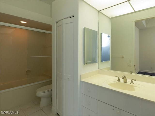 561 Conover Ct, Marco Island, FL 34145 - full bath with tile patterned flooring, toilet, vanity, and combined bath / shower with glass door