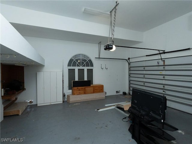 561 Conover Ct, Marco Island, FL 34145 - garage featuring a garage door opener