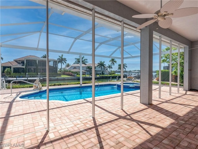 561 Conover Ct, Marco Island, FL 34145 - view of swimming pool featuring a ceiling fan, a patio, a pool with connected hot tub, and a lanai