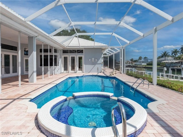 561 Conover Ct, Marco Island, FL 34145 - view of pool with french doors, a pool with connected hot tub, a patio area, and a lanai