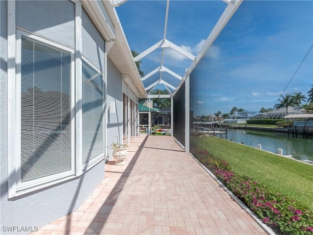 561 Conover Ct, Marco Island, FL 34145 - view of patio featuring a water view and glass enclosure