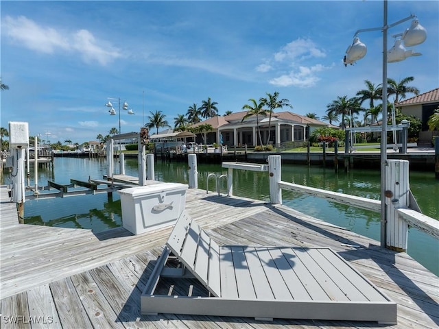 561 Conover Ct, Marco Island, FL 34145 - dock featuring a water view and boat lift