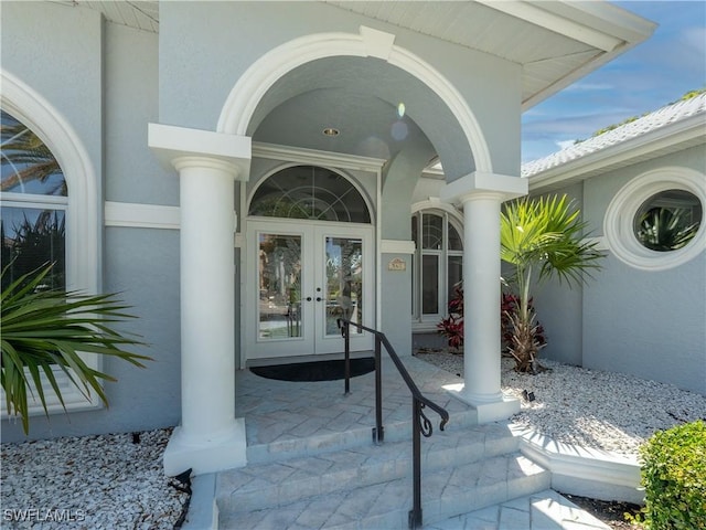 561 Conover Ct, Marco Island, FL 34145 - property entrance with french doors and stucco siding