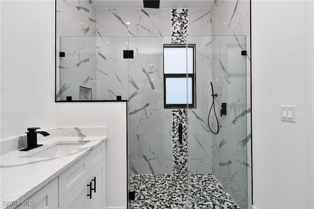 317 Lancelot Ave, Lehigh Acres, FL 33974 - bathroom featuring a marble finish shower and vanity