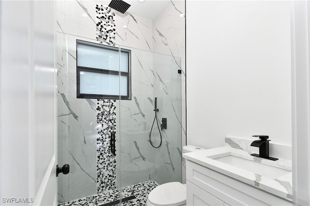 317 Lancelot Ave, Lehigh Acres, FL 33974 - bathroom featuring a marble finish shower, toilet, and vanity