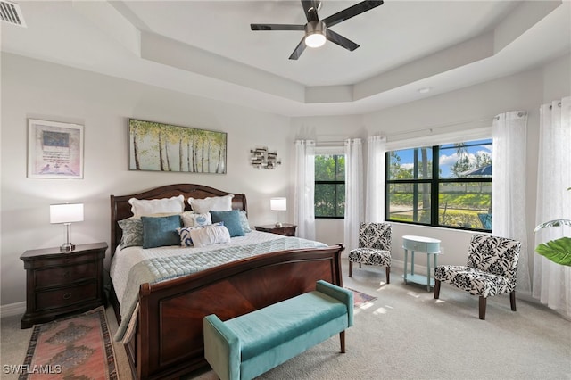 4382 Caldera Cir, Naples, FL 34119 - bedroom featuring light colored carpet, a raised ceiling, baseboards, and ceiling fan