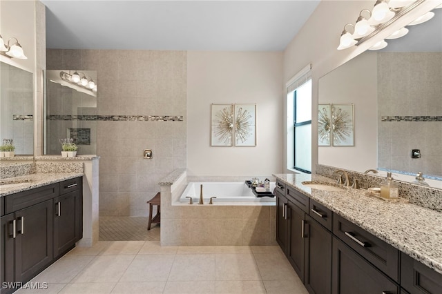 4382 Caldera Cir, Naples, FL 34119 - full bathroom with vanity, tile patterned floors, a bath, and walk in shower