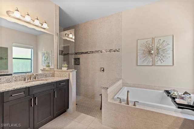 4382 Caldera Cir, Naples, FL 34119 - bathroom featuring a garden tub, vanity, walk in shower, and tile patterned flooring